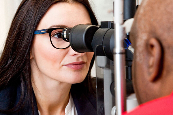 Doctor giving an eye exam