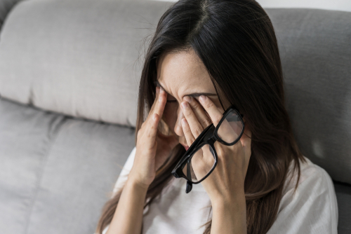 LASIK Livingston Young woman suffering from eye strain, i need of LASIK